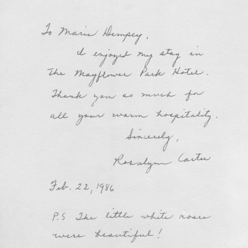 The note appears to be a handwritten dedication or letter, with a short poem or verse and a signature at the bottom, cut in a decorative script line.